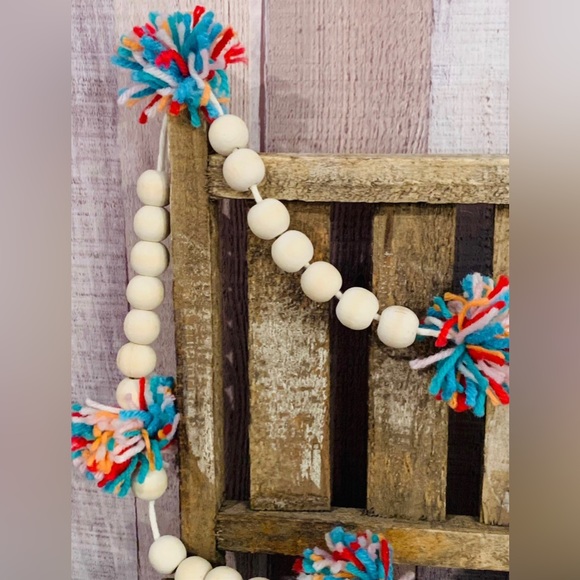 6 Foot Wood Bead Garland with Multi-Colored Yarn Pom Poms - Picture 4 of 9